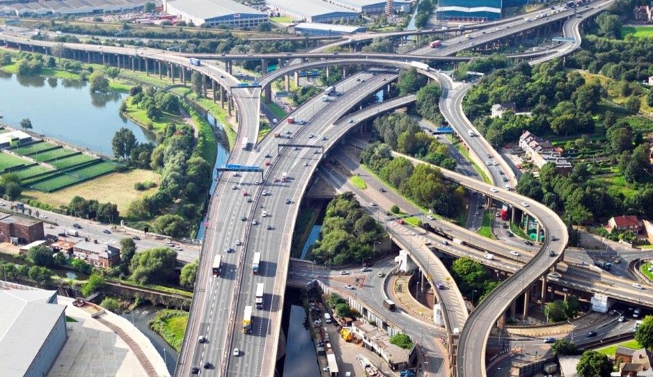 An aerial view of a multi-layered flyover intersection.